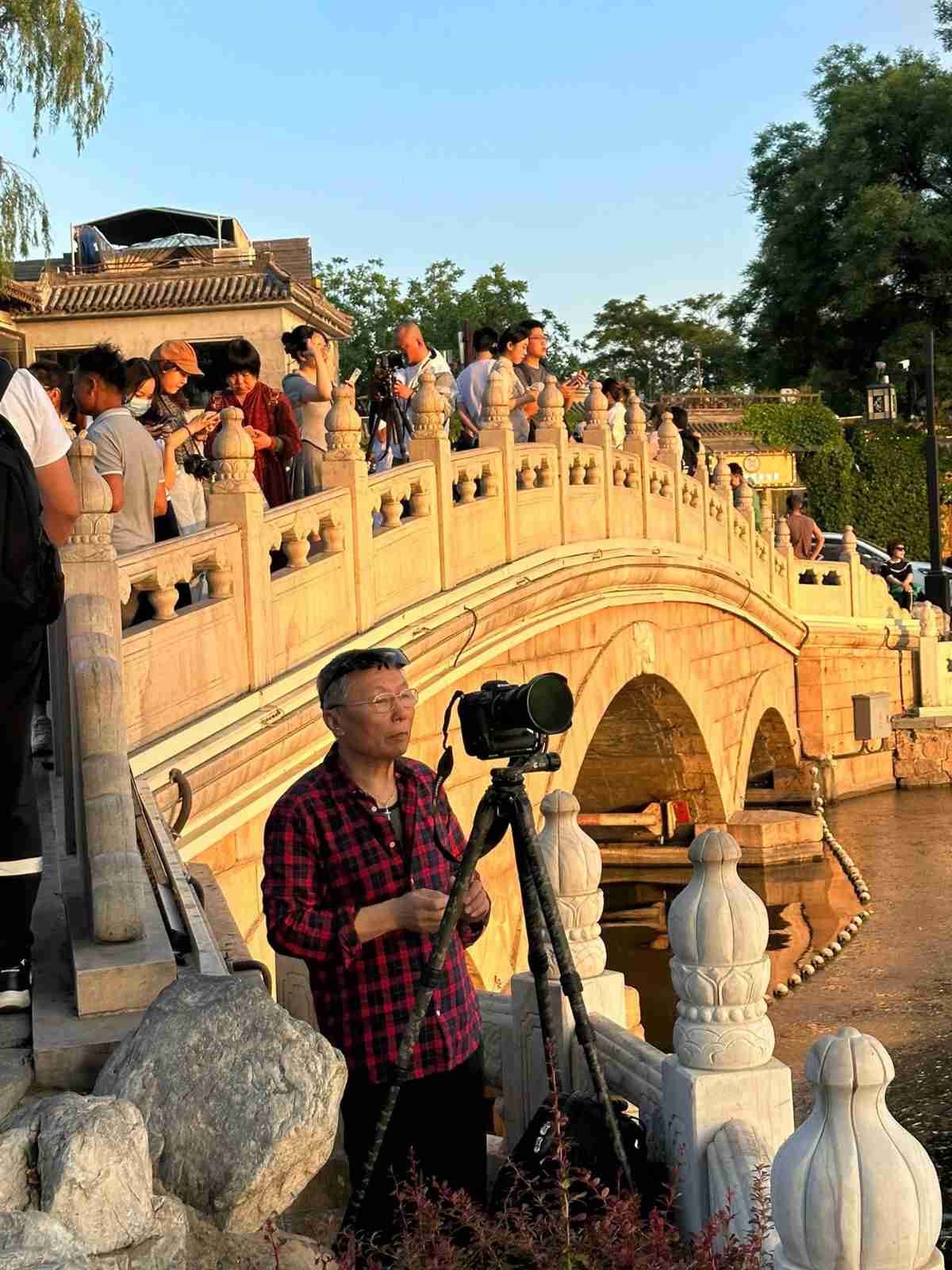People photographing sunset in the hutongs